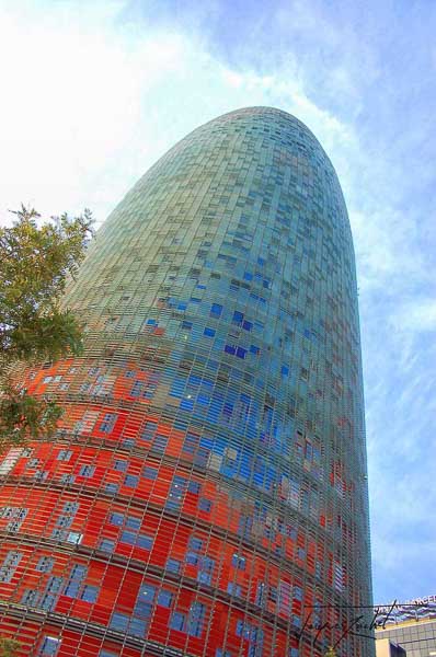 the torre agbar in barcelona, designed by the French architect Jean Nouvel